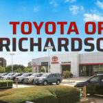 Exterior view of Toyota of Richardson dealership showcasing cars and signage